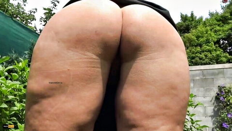Thick woman bends over exposing massive pale ass cheeks and cellulite thighs outdoors