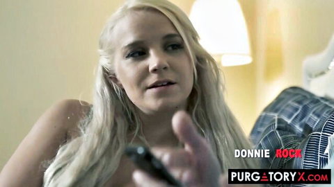 Topless blonde with small perky tits gesturing on plaid couch in porn scene