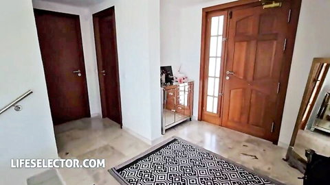 Empty luxury hallway with wooden doors and cabinet in LifeSelector adult video preview.