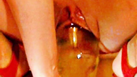 Russian girlfriend stuffs huge vase into her wet pussy closeup