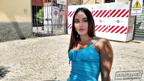 Curvy brunette babe with big tits in tight blue top teasing outdoors