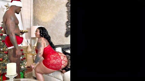 Curvy tattooed ebony in red lace lingerie bends over doggystyle for muscular black Santa's massive BBC at Christmas.