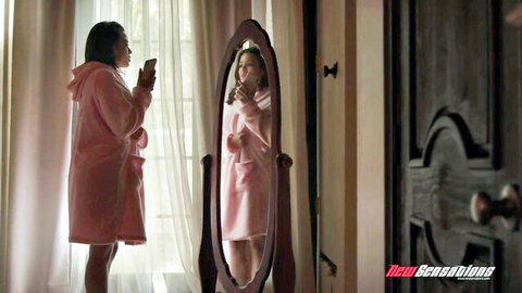 Asian beauty in pink robe takes mirror selfie teasing her curves