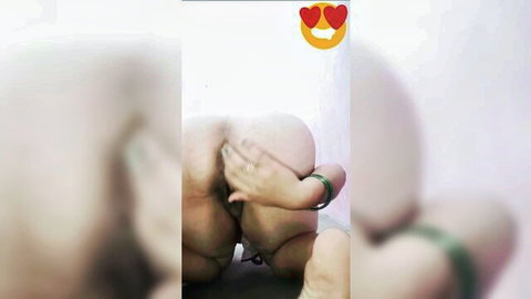 Blurry closeup of pale thick ass cheeks spread by hands with green bangle