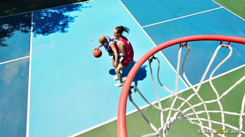 Athletic brunette in tight red basketball shorts dunking ball on outdoor court big ass visible