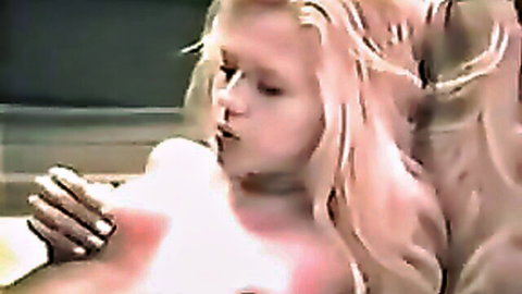 Freckled blonde babe lips parted sucking huge veiny white cock held by black hand