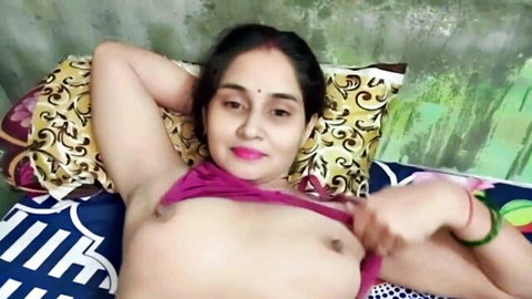 Monu Indian Desi Bhabhi topless, exposing perky tits on bed