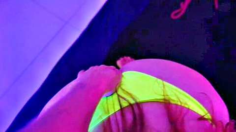 Yola Flimes in neon thong, bent over showing ass in witch-themed scene