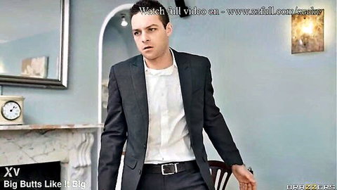 Handsome suited young man standing in elegant bedroom for Brazzers hardcore fuck scene