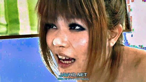 Japanese JAV slut with wide open mouth and intense eyes in closeup ecstasy