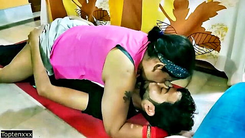 Indian stepmom passionately kissing young man in intimate bedroom embrace