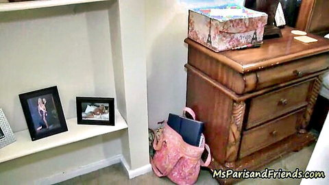 Bedroom dresser with pink backpack, Paris box, sexy photo frames and MsParisandFriends watermark