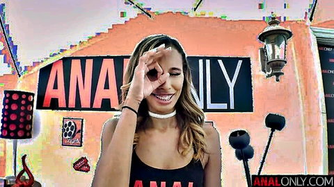 Kylie Le Beau smiling playfully in black tank top for anal tease