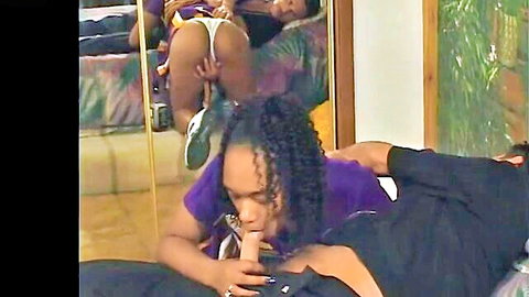 Ebony cheerleader in purple uniform giving blowjob with big ass view