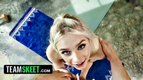 Scarlett Hampton nude yoga pose on mat, smiling up at POV camera