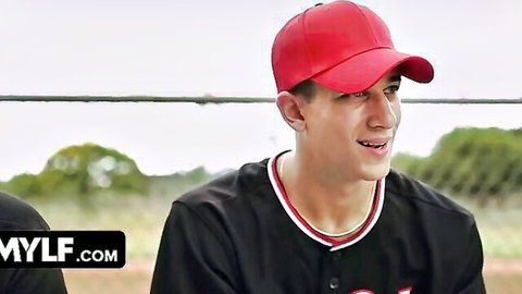 Handsome young baseball stud in red cap and black jersey smiling confidently for MYLF