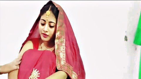 Sexy Indian bride in red saree with big tits cleavage smiling seductively