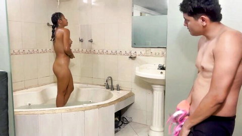 Nude Asian stepsister standing in bathtub with shirtless stepbrother nearby
