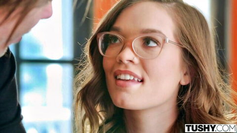 Katie Kush smiling in glasses, teasing anal action