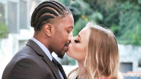 Anna Claire Clouds shares sensual kiss with suited Black stud in red dress