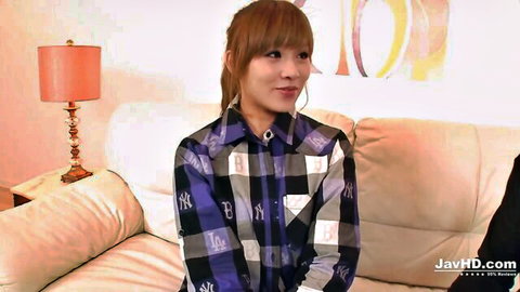 Rinka Aiuchi in sexy plaid Yankees shirt, sitting casually in JAV scene