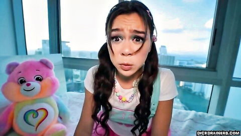 Cute pigtail Latina girl in playful outfit with teddy bear, teasing study session vibe