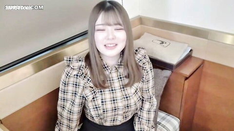 Cute Asian newbie girl in frilly plaid blouse and skirt smiling at camera