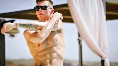 Muscular shirtless man in Isabella De Laa threesome poses outdoors