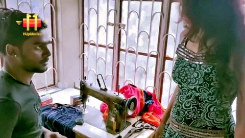 Sexy Indian beauty in green dress chats with male tailor in cheating scene