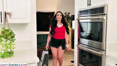 Mandy Muse in red crop top and black mini skirt, teasing walk