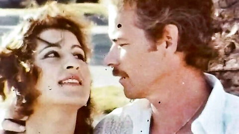 Retro curly-haired babe in intimate gaze with mustached man, vintage porn tease