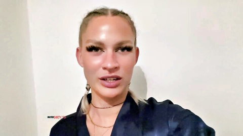 Sultry blonde with cornrows and glossy plump lips wearing choker necklace closeup
