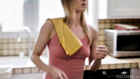Riley Reyes blonde in pink tank top and yellow towel in kitchen tease
