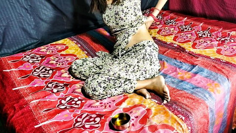 Seductive Indian MILF in revealing floral outfit, wrists bound, solo tease