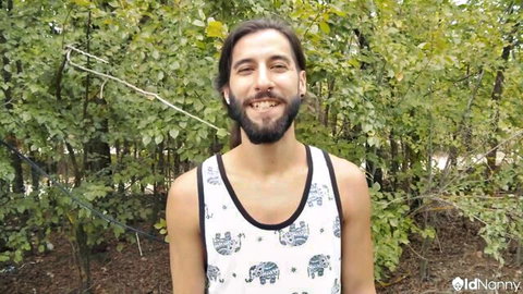 Bearded man in elephant tank top smiling outdoors, Agata Miller granny anal scene