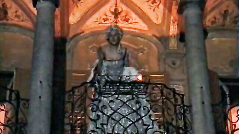 Vintage princess in lacy white gown teasing behind ornate railings in medieval hall