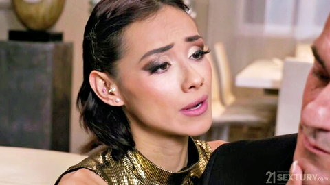 Asian brunette in gold top moans intensely with man's face close during steamy foreplay
