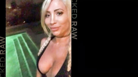 Blonde with pigtails teases massive cleavage in low-cut top by pool