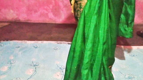 Sexy Indian Bhabhi in green saree posing in homemade adult video