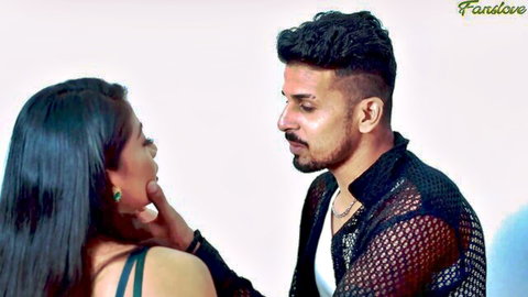 Sexy Indian housewife in black top gazes passionately at handsome bearded man in sheer shirt during intimate foreplay
