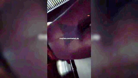 Blurry closeup of ebony woman's dark thigh in purple light with OnlyFans watermark