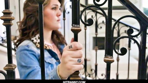 Kinky TS brunette gripping bars in teasing pose, Brazzers hardcore preview