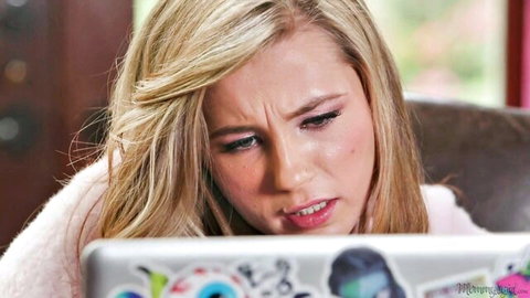 Carolina Sweets looking intense at laptop in steamy Mommy's Girl scene