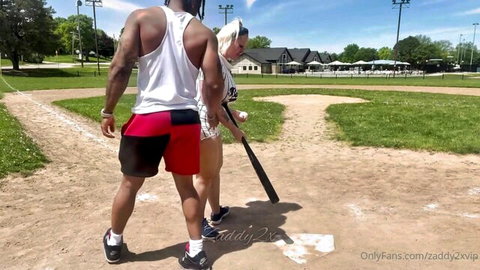 Mz Dani and Zaddy in sporty outfits on baseball field, OnlyFans exclusive