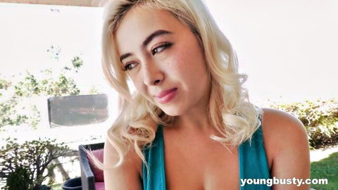 Busty blonde Chloe Surreal teases in low-cut teal tank top outdoors