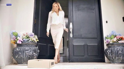 Blonde MILF Vivianne DeSilva in blouse and skirt approaches door with package