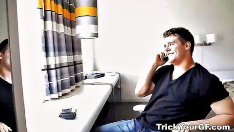 Muscular stud in black shirt smiles on phone call in hotel room voyeur cam