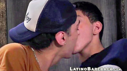 Two hot Latino boys in hats passionately French kissing, bareback gay action tease