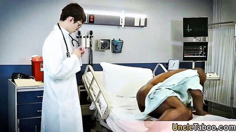 Kinky white doctor examines muscular black patient with massive BBC in hospital