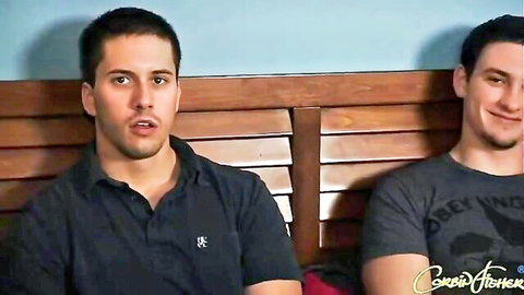 Two handsome athletic men smiling casually in shirts